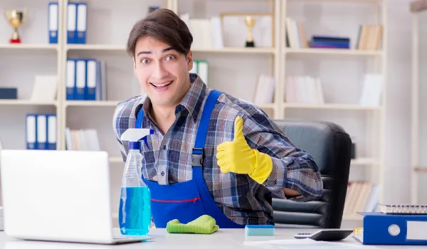 Male cleaner working in the office