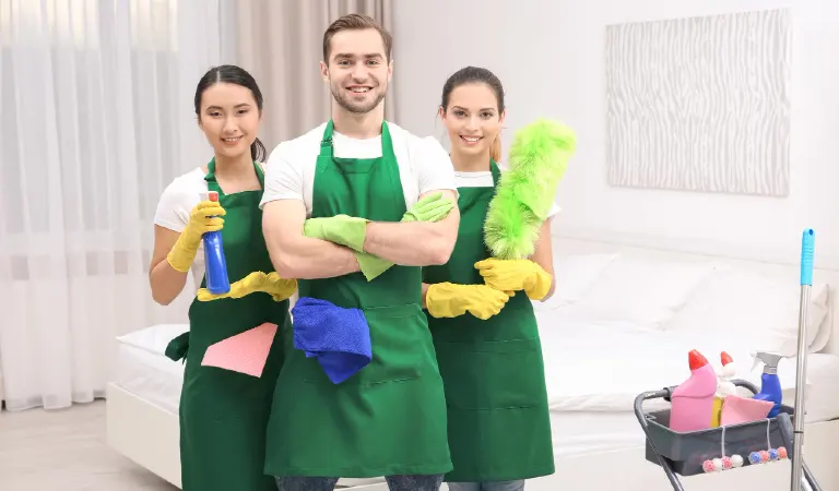 Cleaning service team at work in bedroom