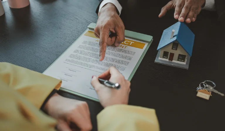 Real estate agent is explaining details of home contract